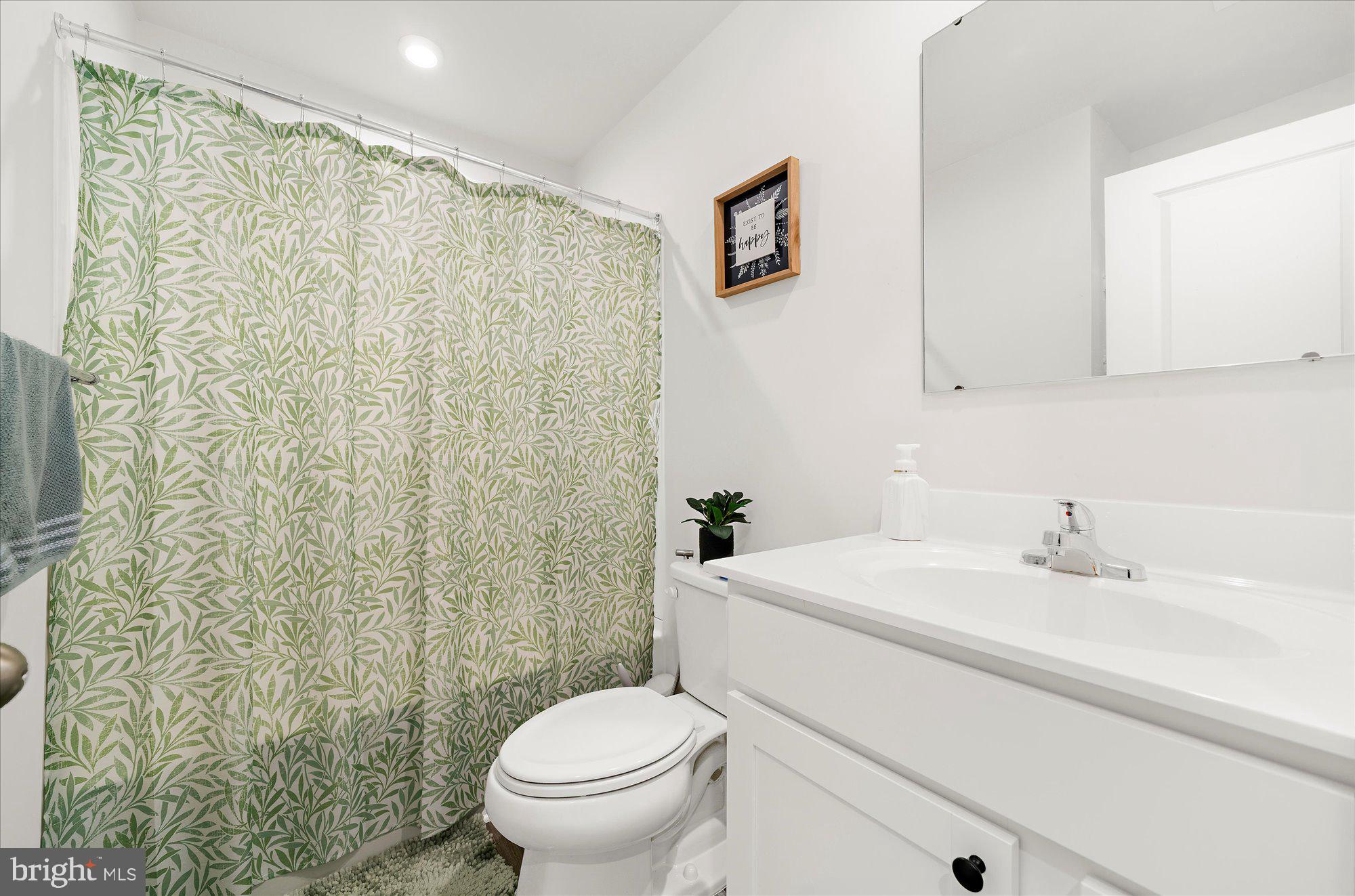 39 Wendowski Street Beverly, NJ 08010 - Photo 16 of 25 a bathroom with a sink a toilet and a mirror