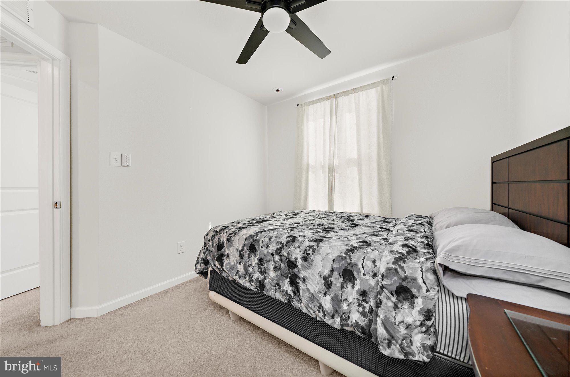 39 Wendowski Street Beverly, NJ 08010 - Photo 18 of 25 a bedroom with a bed and a window