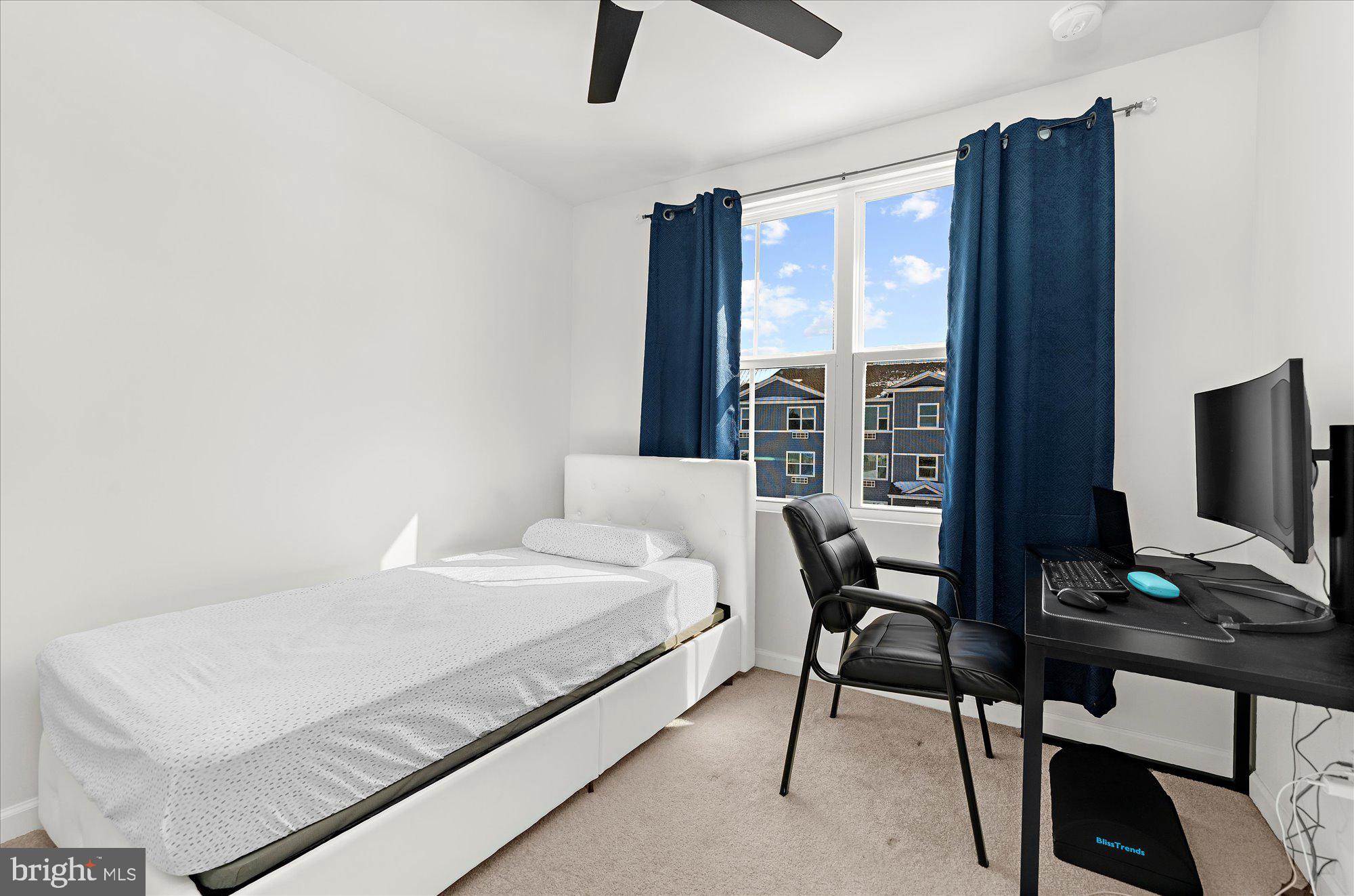 39 Wendowski Street Beverly, NJ 08010 - Photo 20 of 25 a bedroom with a bed and a flat screen tv