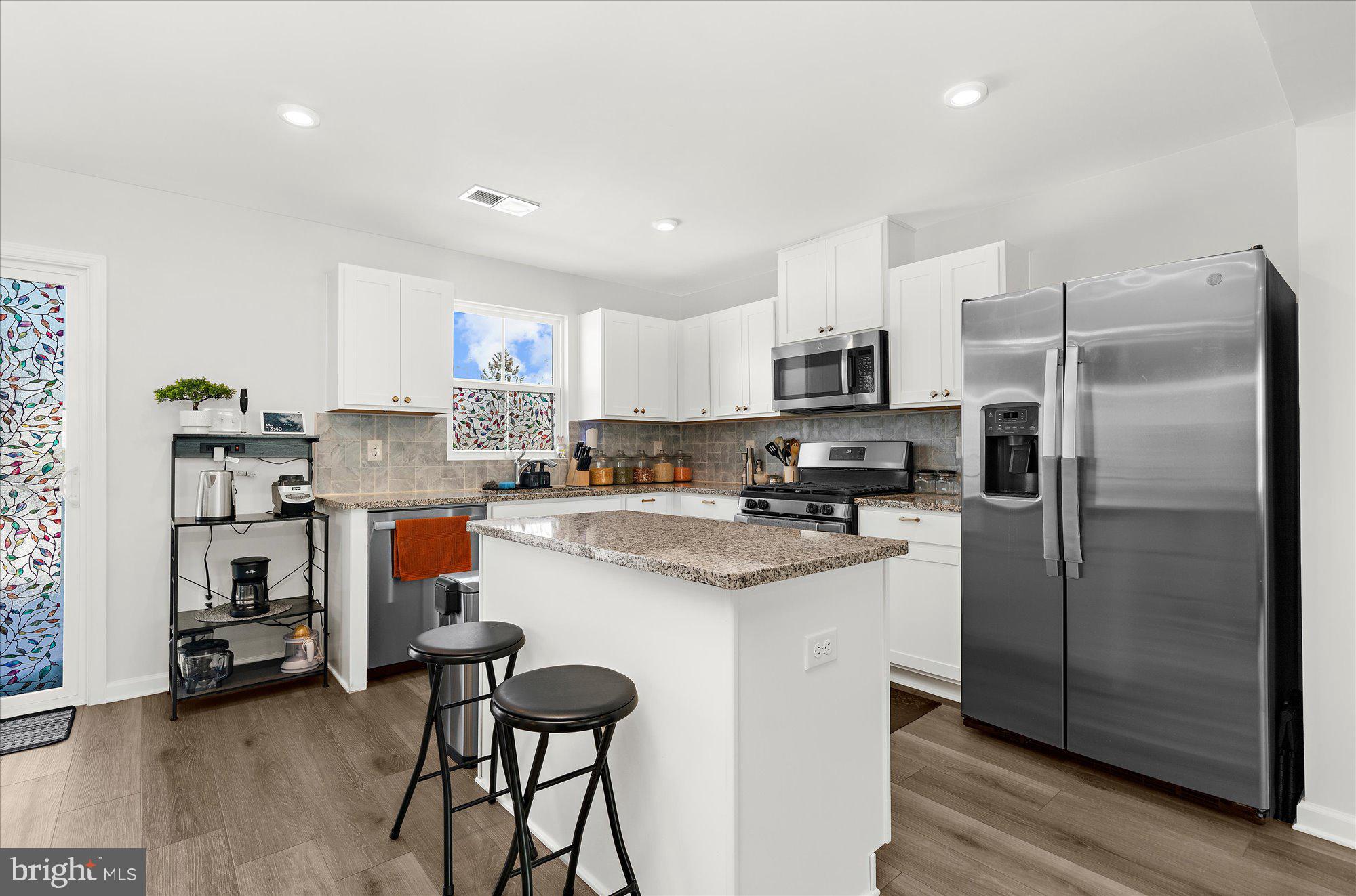 39 Wendowski Street Beverly, NJ 08010 - Photo 3 of 25 a kitchen with stainless steel appliances granite countertop a refrigerator and a stove top oven