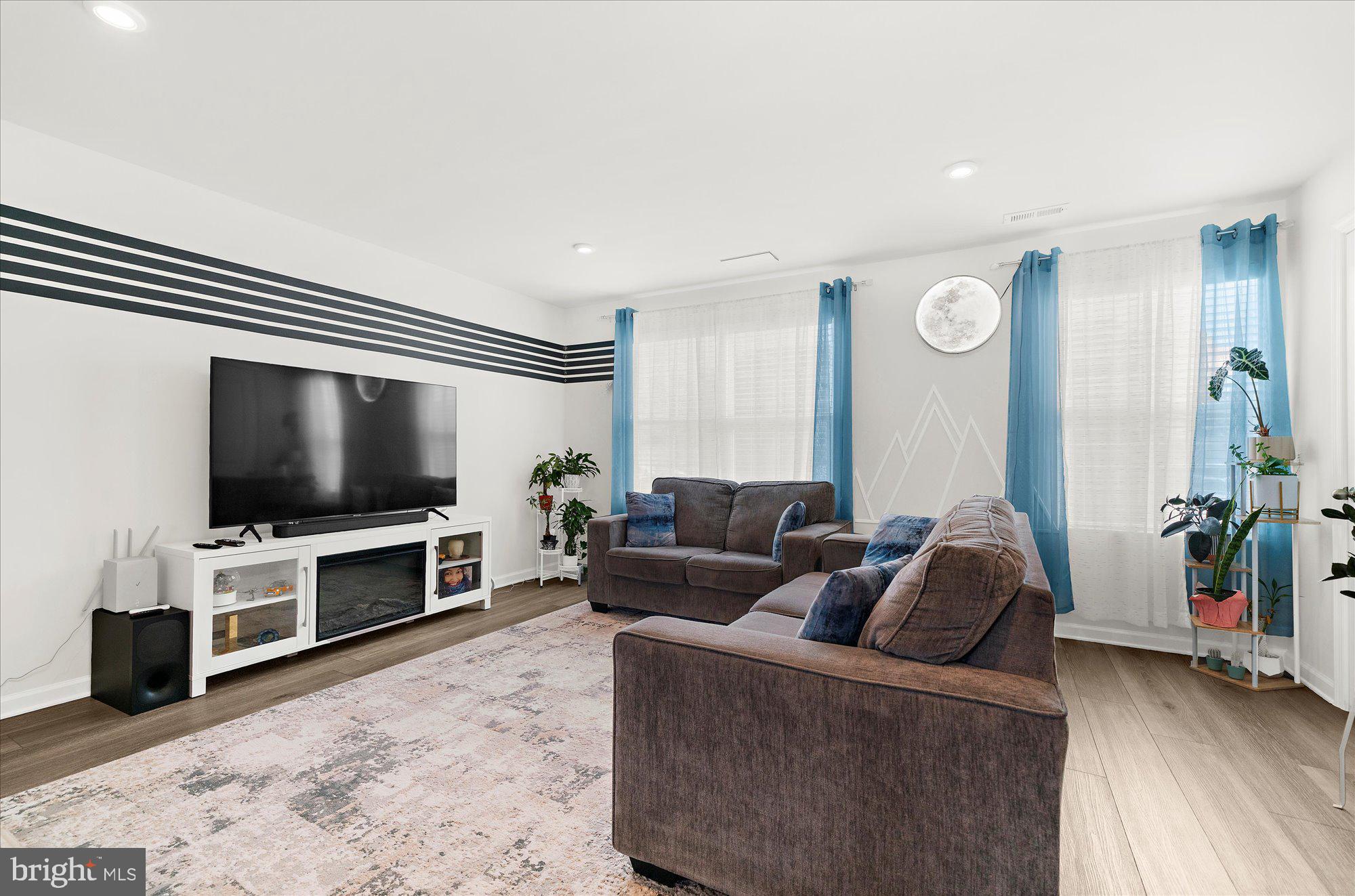 39 Wendowski Street Beverly, NJ 08010 - Photo 7 of 25 a living room with furniture and a flat screen tv