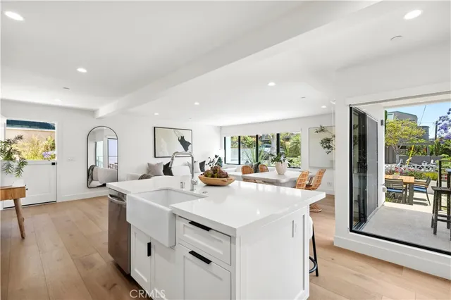 a view of kitchen island a sink and living room