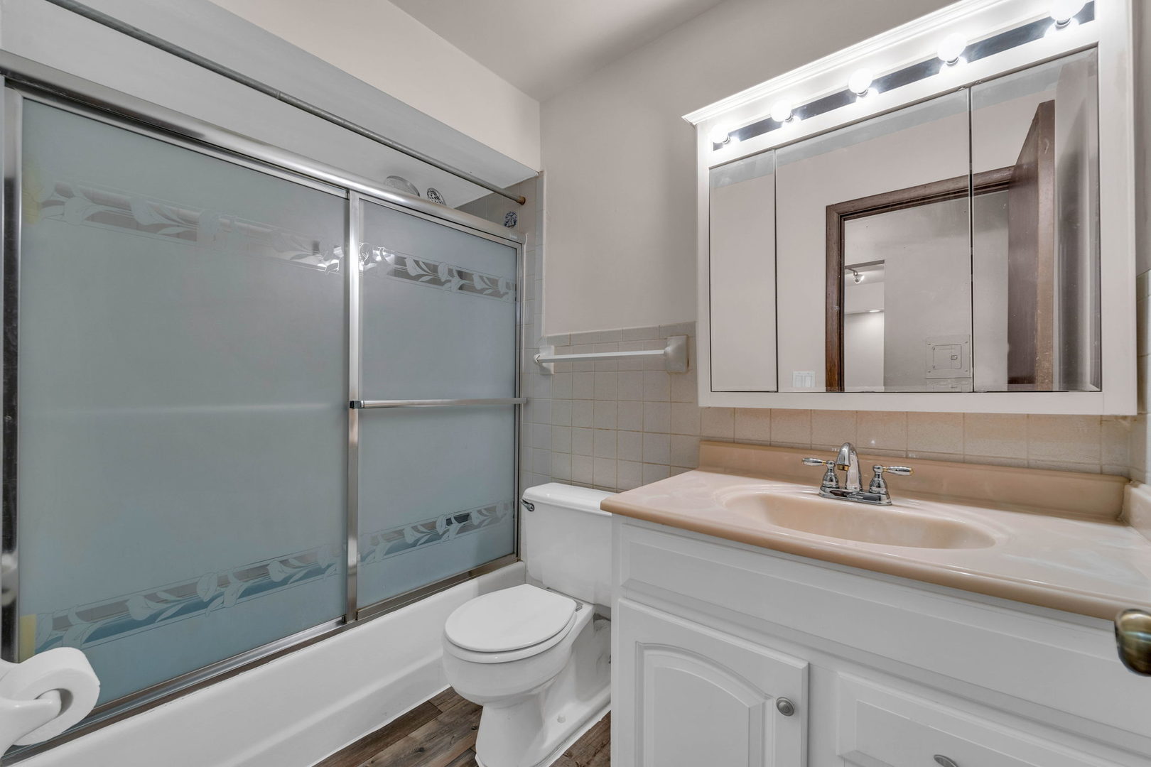 239 North Mill Road, Unit 104A Addison, IL 60101 - Photo 8 of 14 a bathroom with a sink a toilet and shower