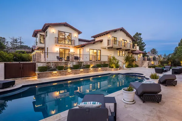 a view of a street with cars parked on the roadside