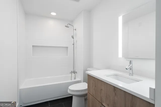 a bathroom with a sink toilet and a bathtub