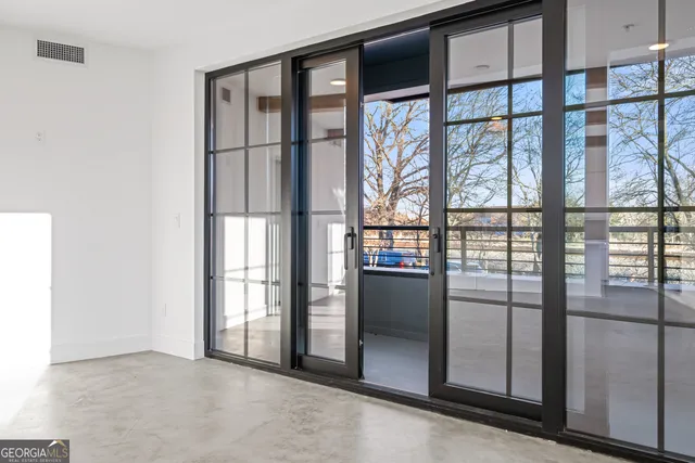 a view of empty room with windows