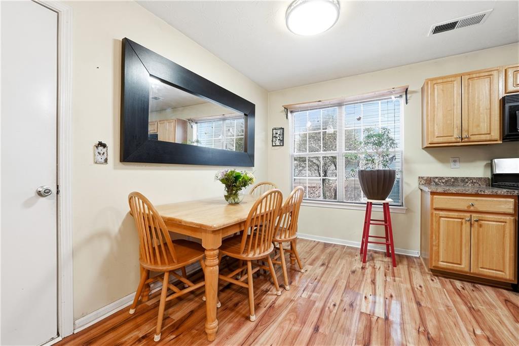 20 Ivans Circle Covington, GA 30016 - Photo 17 of 29 a dining room with furniture and wooden floor
