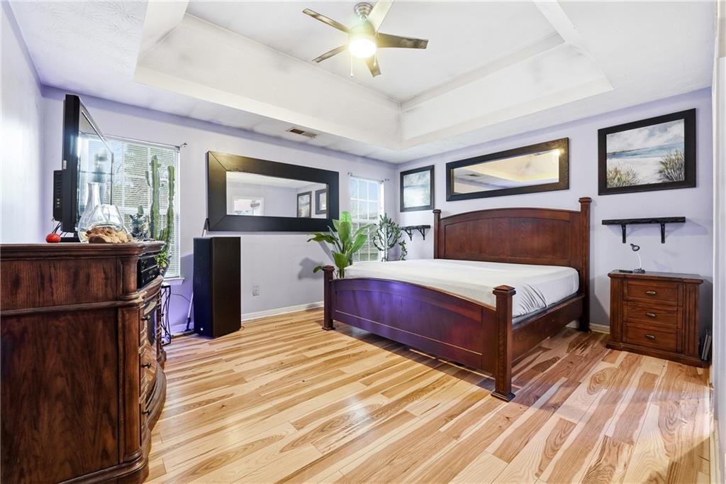 20 Ivans Circle Covington, GA 30016 - Photo 18 of 29 a bedroom with a bed and a dresser