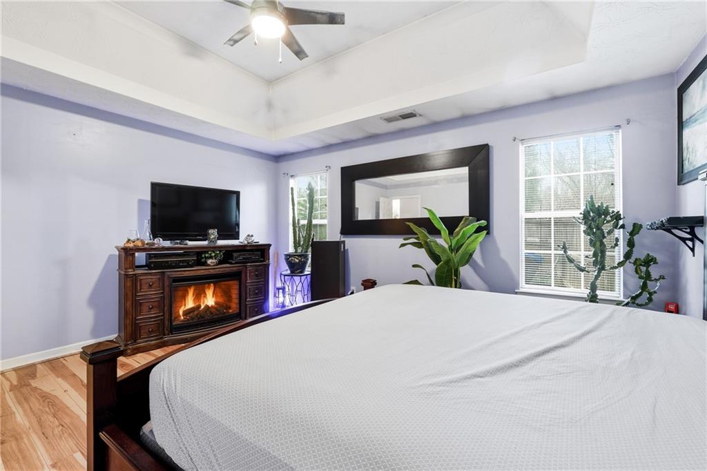 20 Ivans Circle Covington, GA 30016 - Photo 19 of 29 a bedroom with a bed and a flat screen tv