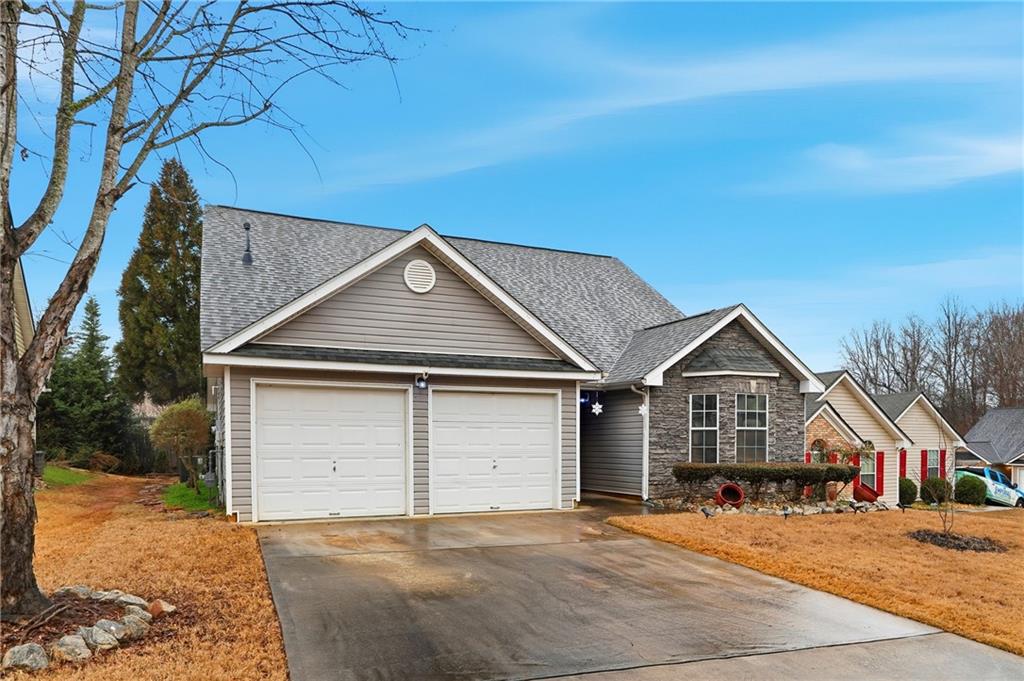 20 Ivans Circle Covington, GA 30016 - Photo 2 of 29 a front view of a house with a yard and garage