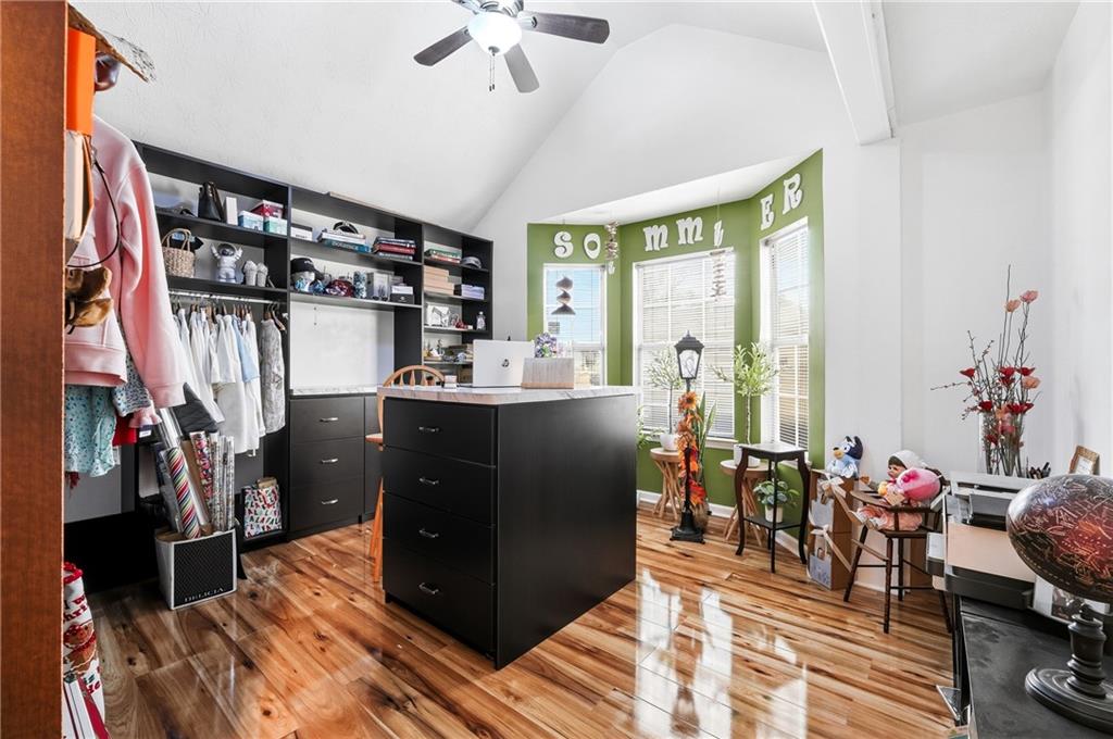 20 Ivans Circle Covington, GA 30016 - Photo 24 of 29 a living room with lots of furniture and a chandelier