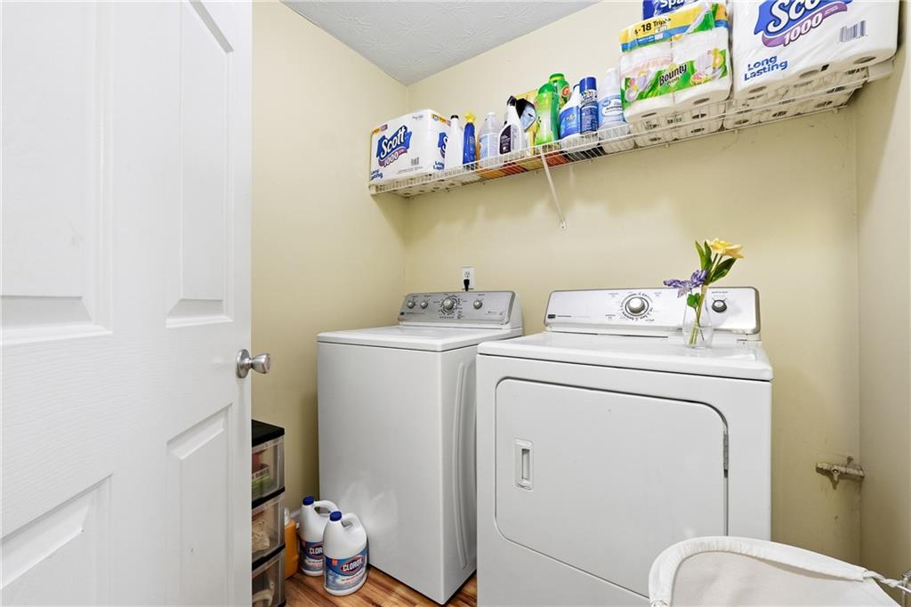 20 Ivans Circle Covington, GA 30016 - Photo 27 of 29 a utility room with dryer and washer