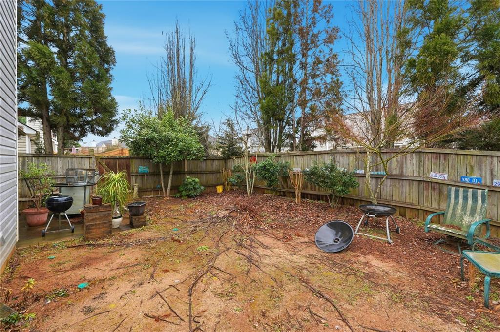 20 Ivans Circle Covington, GA 30016 - Photo 28 of 29 a view of a table and chairs in backyard