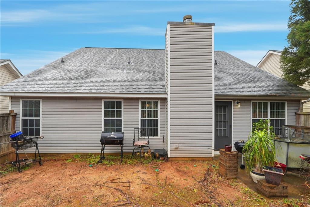 20 Ivans Circle Covington, GA 30016 - Photo 29 of 29 a backyard of a house with seating space