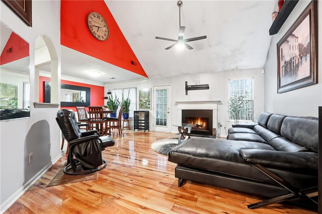 20 Ivans Circle Covington, GA 30016 - Photo 6 of 29 a living room with furniture and a fireplace