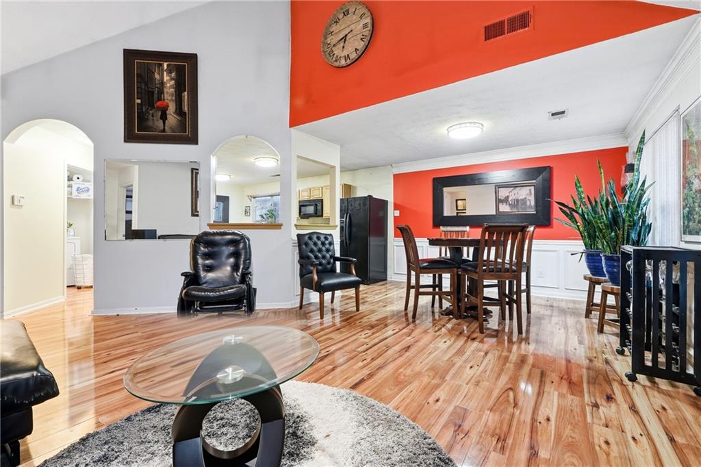 20 Ivans Circle Covington, GA 30016 - Photo 8 of 29 a living room with furniture a wooden floor and next to a window