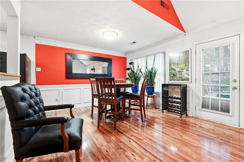 20 Ivans Circle Covington, GA 30016 - Photo 10 of 29 a dining room with furniture window wooden floor