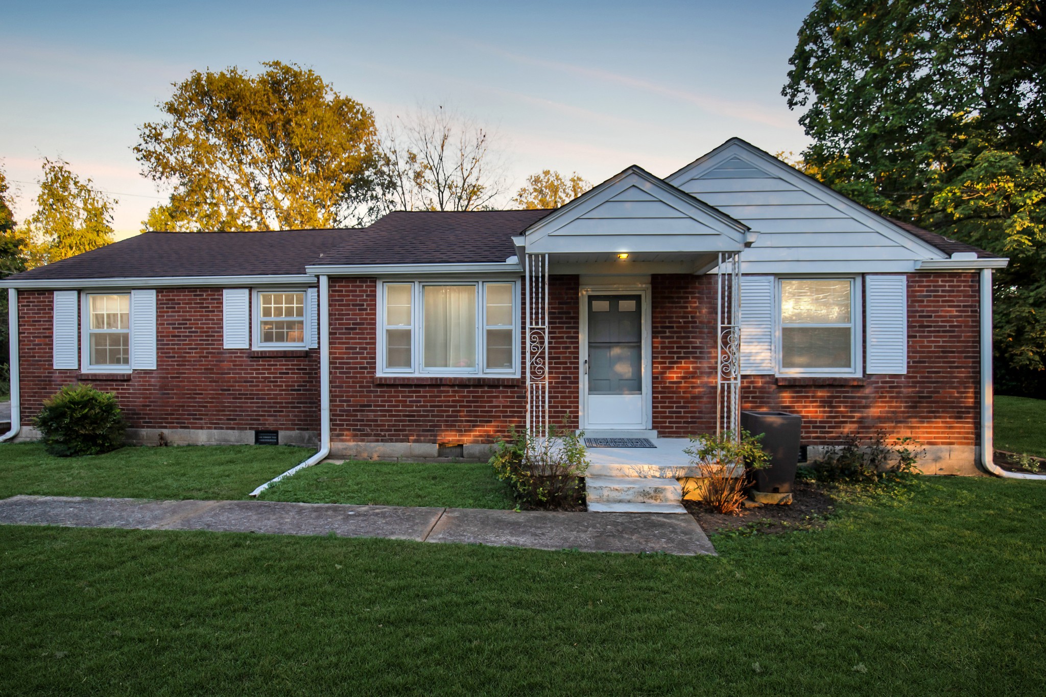 709 Nix Pass Madison, TN 37115 - Photo 8 of 33 a front view of a house with a yard and porch