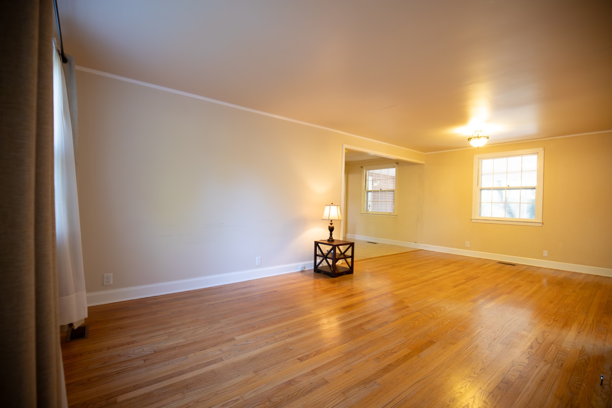 709 Nix Pass Madison, TN 37115 - Photo 10 of 33 an empty room with wooden floor and windows
