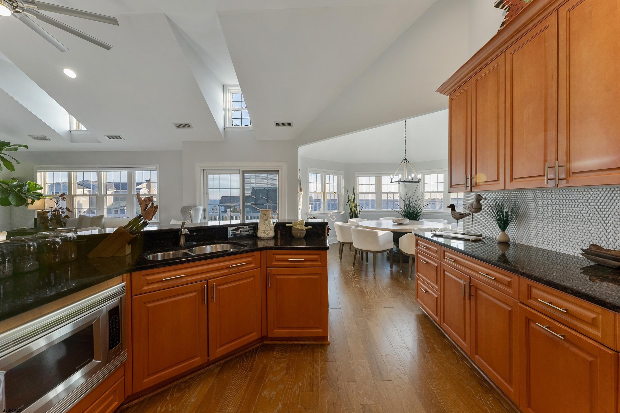 102 Broadway, Unit 2 Somers Point, NJ 08244 - Photo 20 of 98 a kitchen with lots of counter top space and dining table