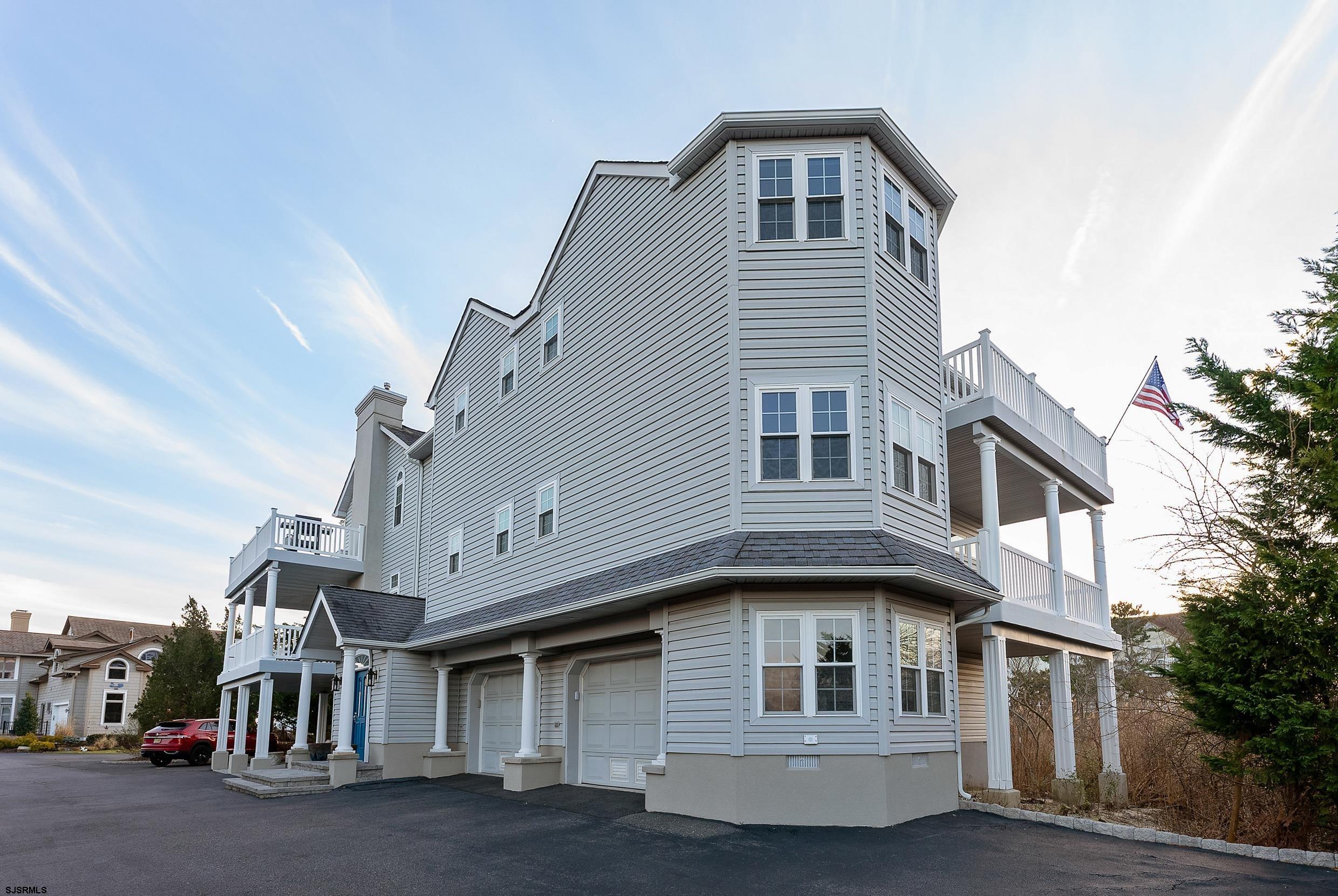 102 Broadway, Unit 2 Somers Point, NJ 08244 - Photo 2 of 98 a front view of a house with a garage