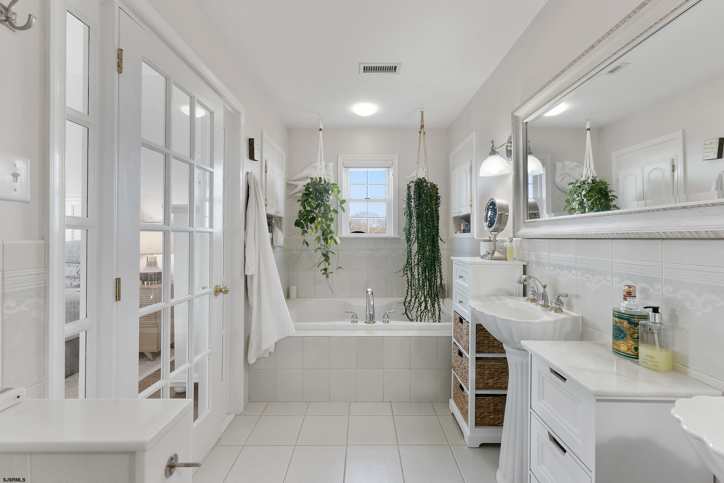 102 Broadway, Unit 2 Somers Point, NJ 08244 - Photo 49 of 98 a bathroom with a bathtub shower sink and toilet