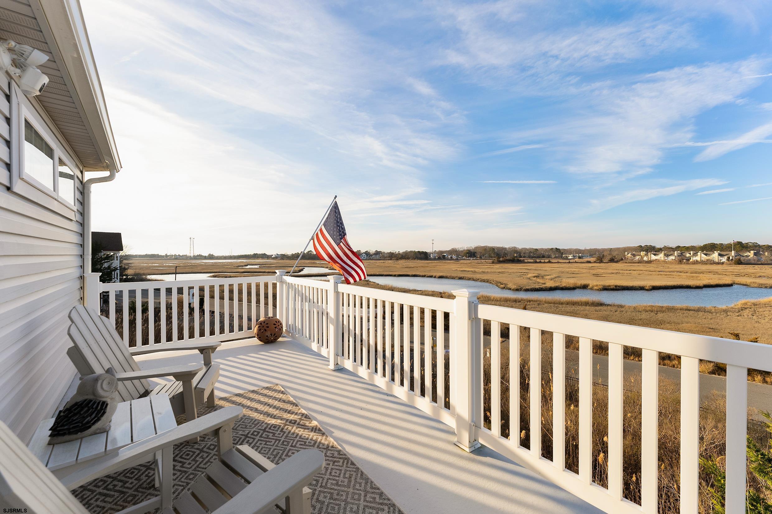 102 Broadway, Unit 2 Somers Point, NJ 08244 - Photo 56 of 98 a view of a roof deck with wooden floor and fence