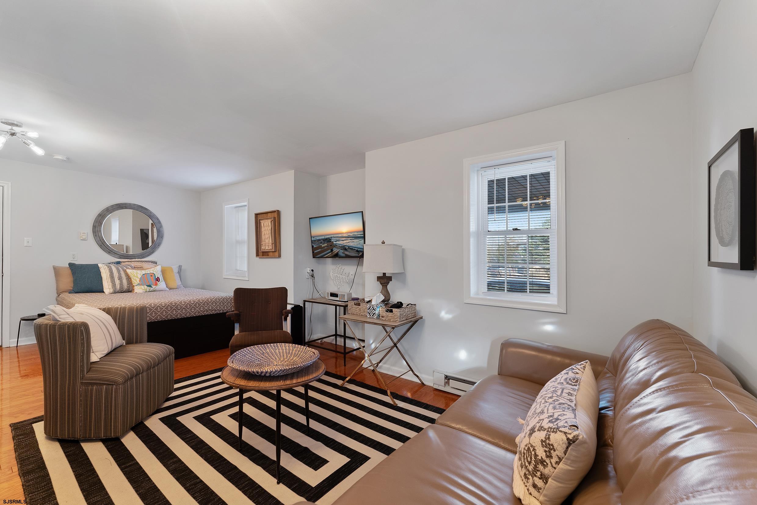 102 Broadway, Unit 2 Somers Point, NJ 08244 - Photo 6 of 98 a living room with furniture and a window
