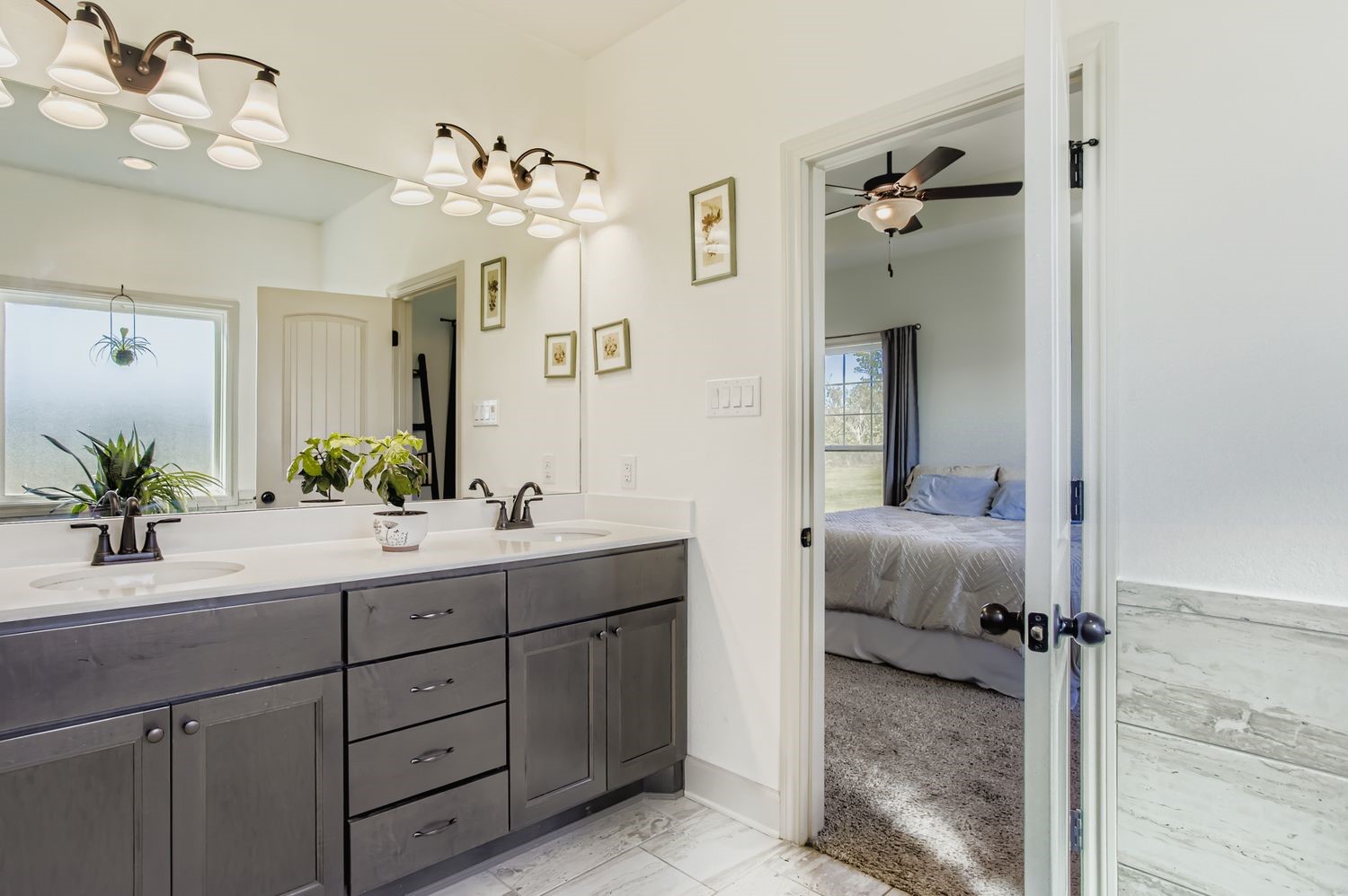 32123 Howell Road Waller, TX 77484 - Photo 19 of 28 a bathroom with a double vanity sink mirror and