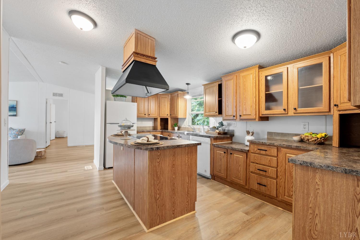 128 Douglas Drive Dry Fork, VA 24549 - Photo 13 of 45 a kitchen with stainless steel appliances granite countertop a stove and more cabinets
