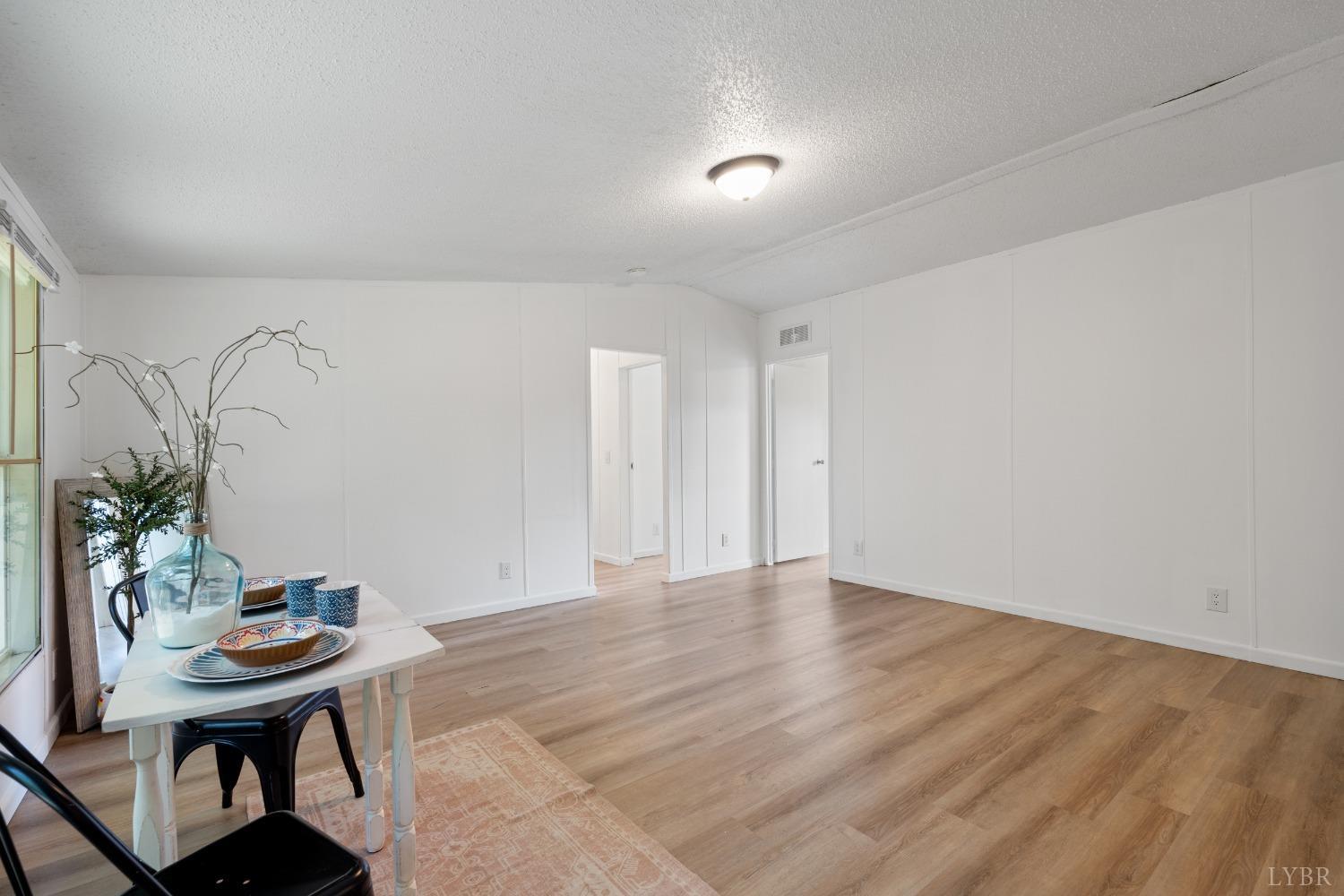128 Douglas Drive Dry Fork, VA 24549 - Photo 18 of 45 a view of a livingroom with furniture and wooden floor