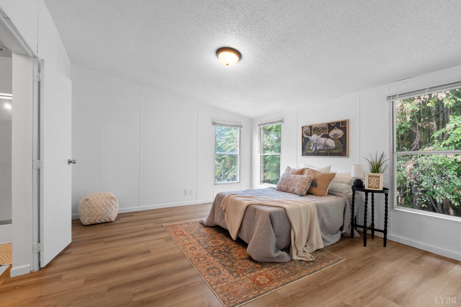 128 Douglas Drive Dry Fork, VA 24549 - Photo 19 of 45 a bedroom with a bed and a window