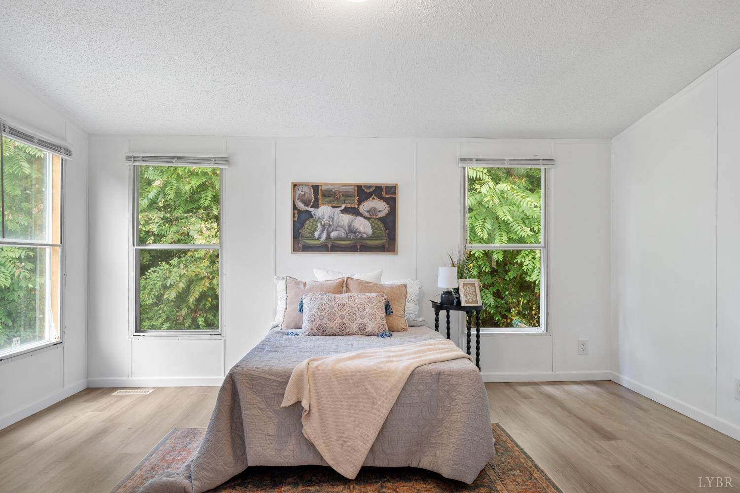 128 Douglas Drive Dry Fork, VA 24549 - Photo 20 of 45 a bedroom with a bed and a window