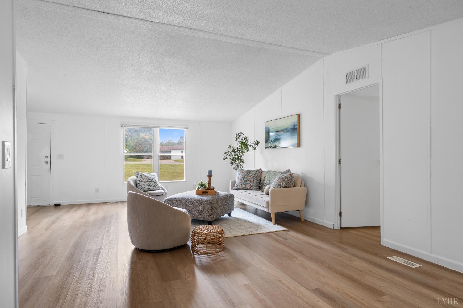 128 Douglas Drive Dry Fork, VA 24549 - Photo 4 of 45 a living room with furniture and a wooden floor
