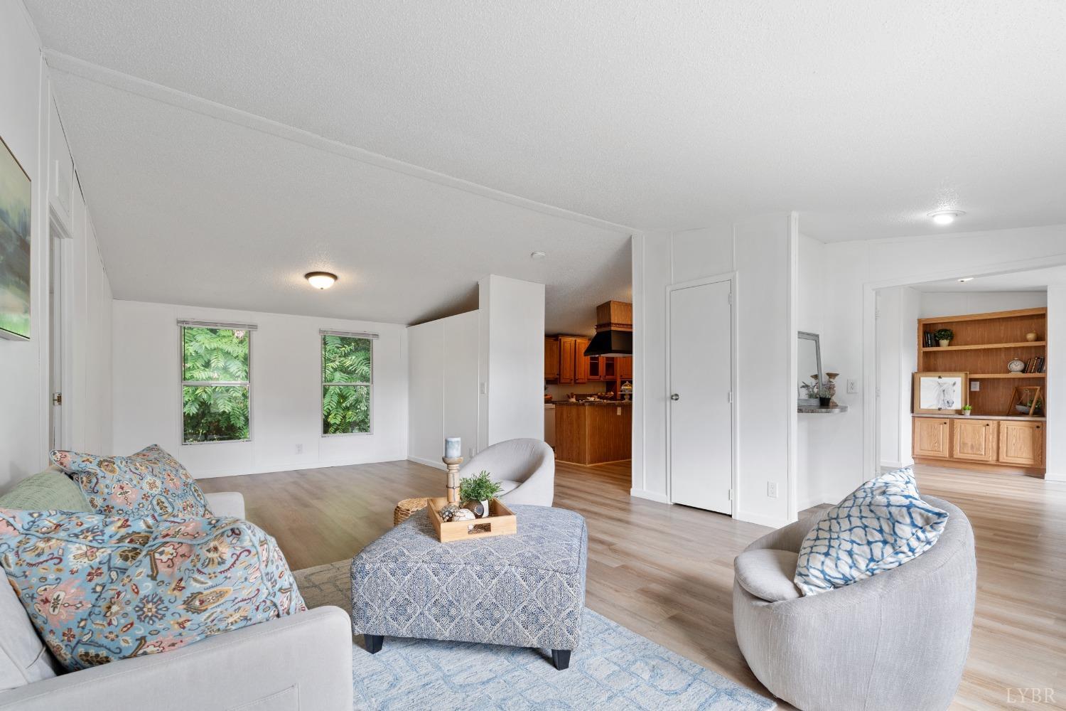 128 Douglas Drive Dry Fork, VA 24549 - Photo 6 of 45 a living room with furniture and a large window