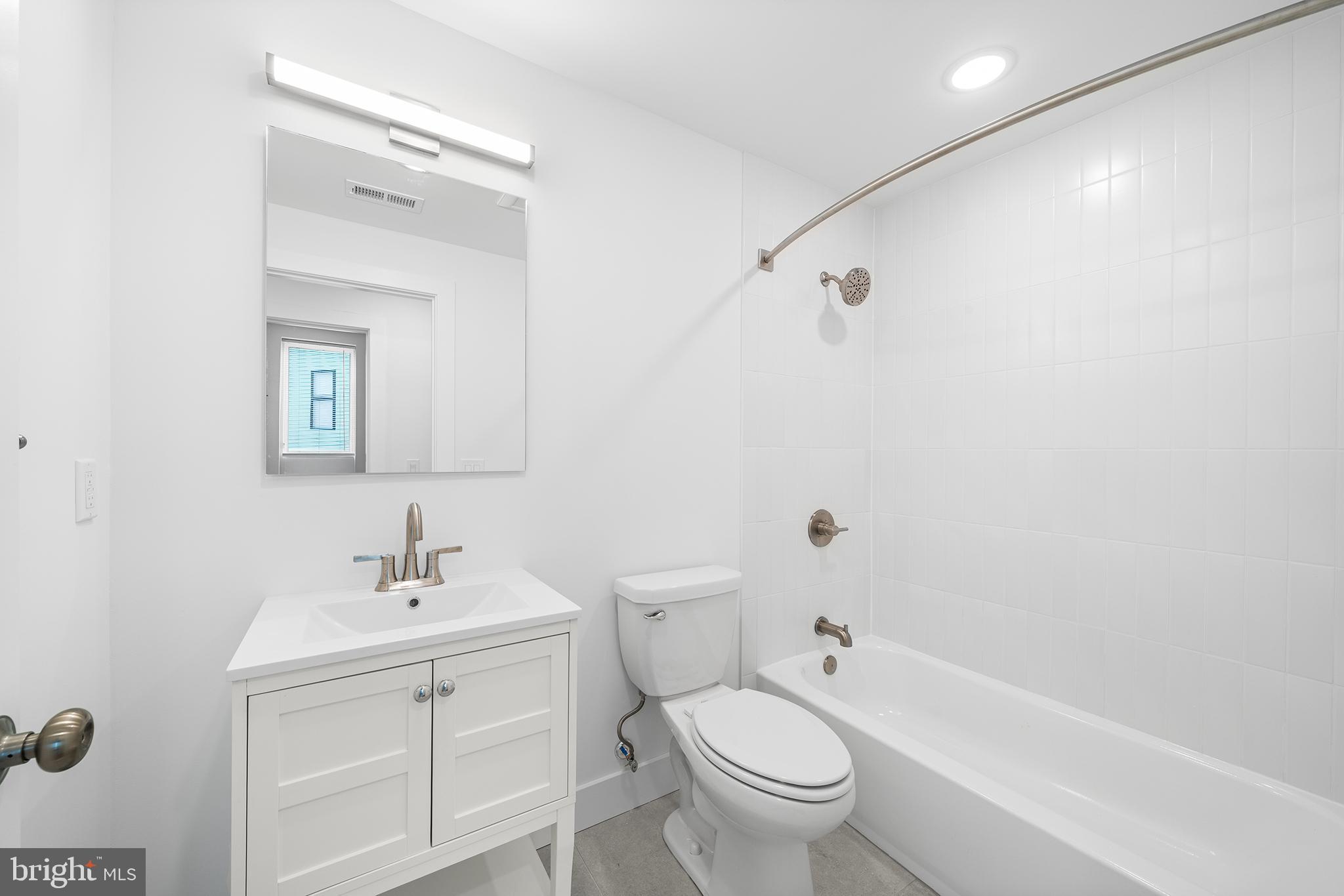 4324 Lancaster Avenue, Unit 100 Philadelphia, PA 19104 - Photo 19 of 19 a bathroom with a sink toilet and shower