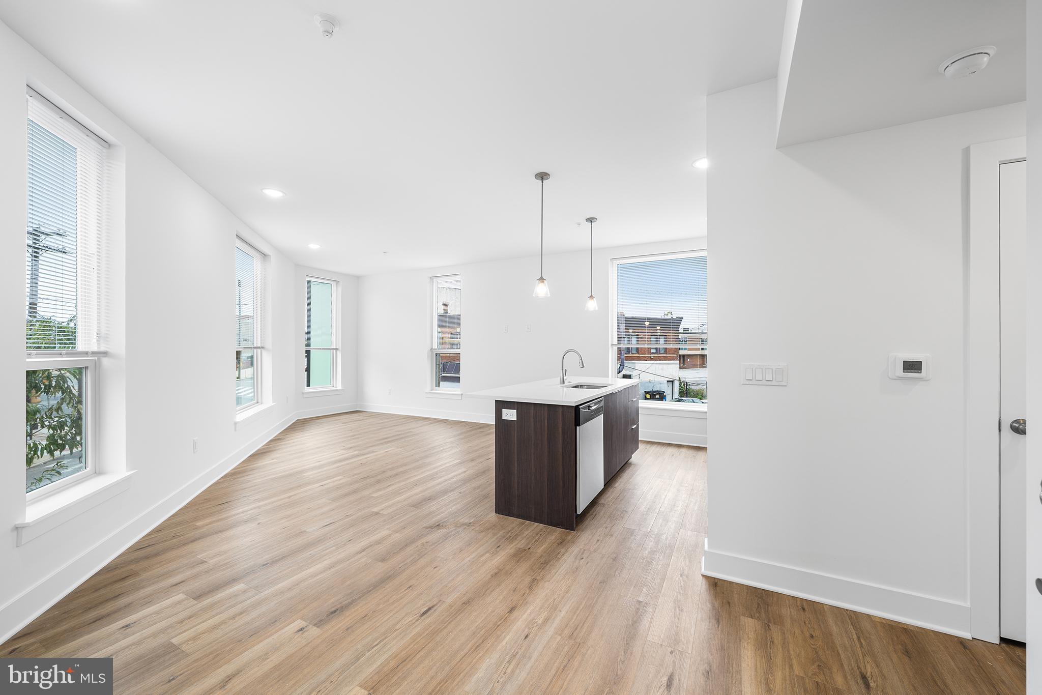 4324 Lancaster Avenue, Unit 100 Philadelphia, PA 19104 - Photo 2 of 19 a view of kitchen with wooden floor and window