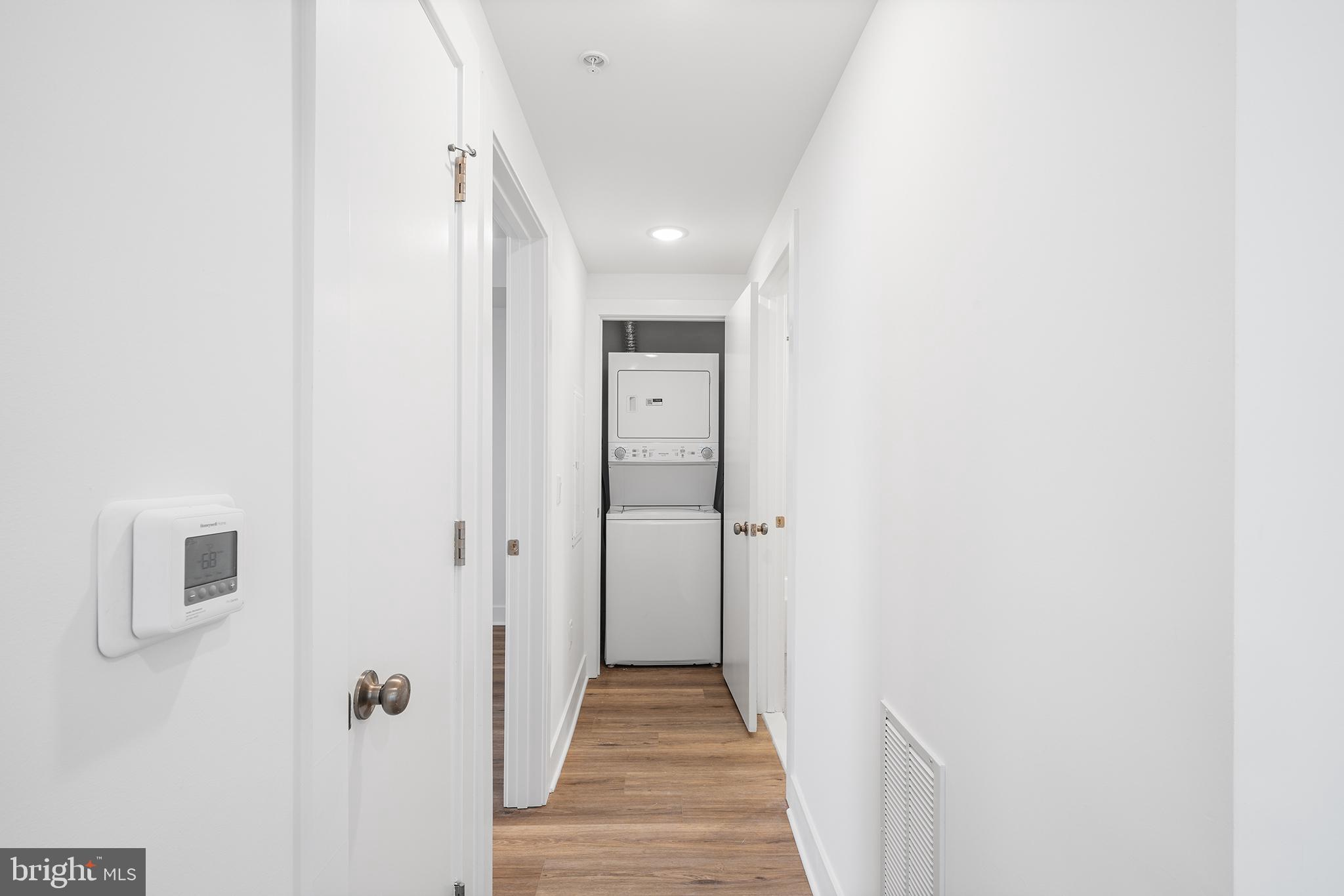 4324 Lancaster Avenue, Unit 100 Philadelphia, PA 19104 - Photo 8 of 19 a view of a hallway with wooden floor
