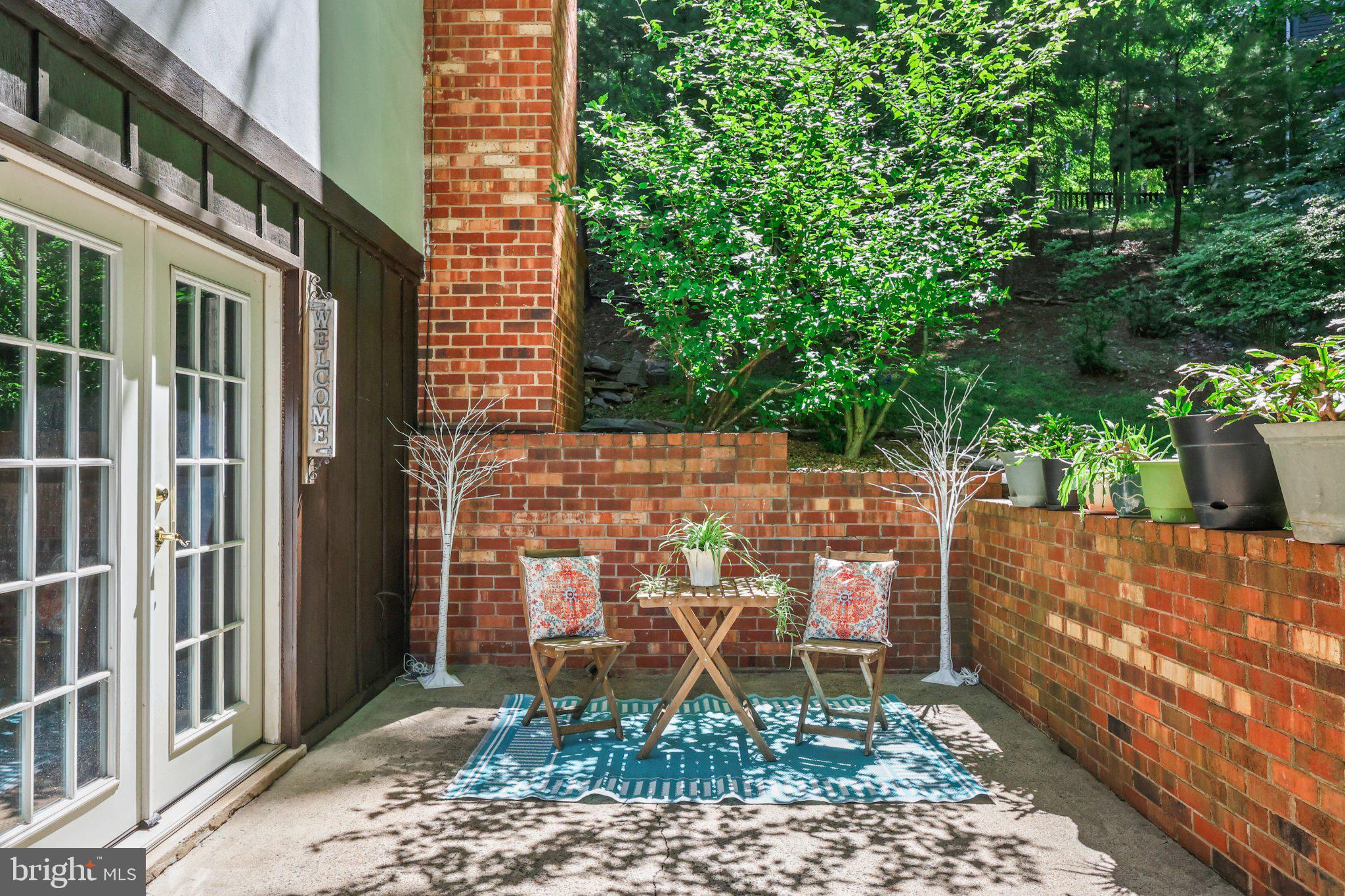 7357 Auburn Mill Road Warrenton, VA 20187 - Photo 27 of 35 Serene patio retreat in lush greenery.