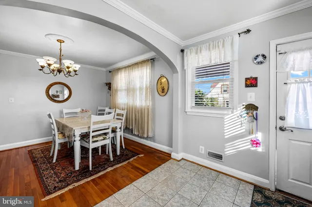 a view of a dining room and wooden floor