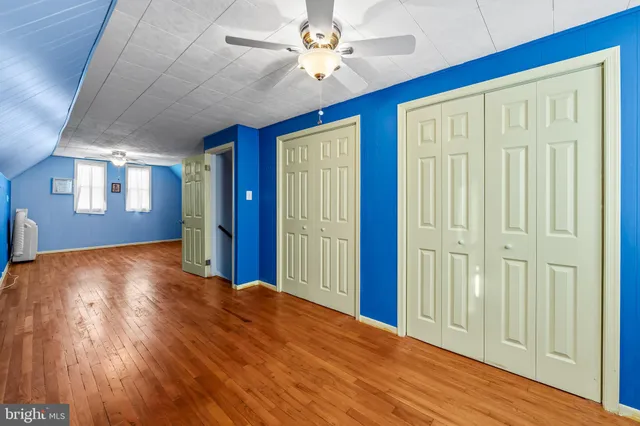 a view of a livingroom with a chandelier fan