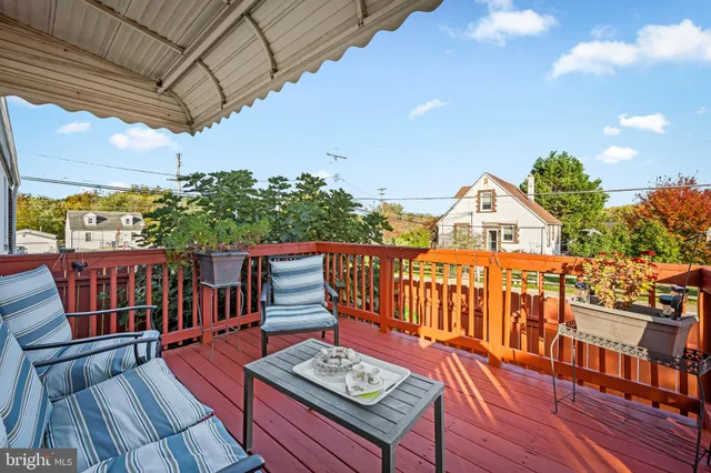 a view of balcony with wooden floor