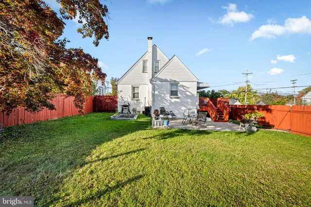 a view of a house with backyard porch and sitting area