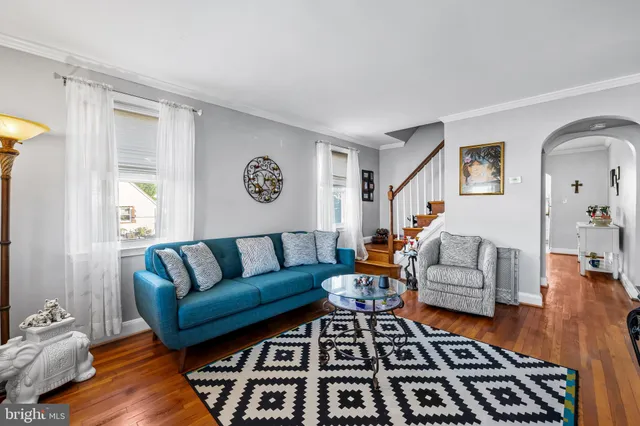 a living room with furniture and a rug
