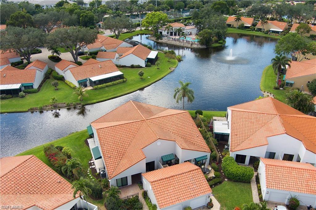 845 Reef Point Circle Naples, FL 34108 - Photo 32 of 41 an aerial view of house with yard swimming pool and outdoor seating