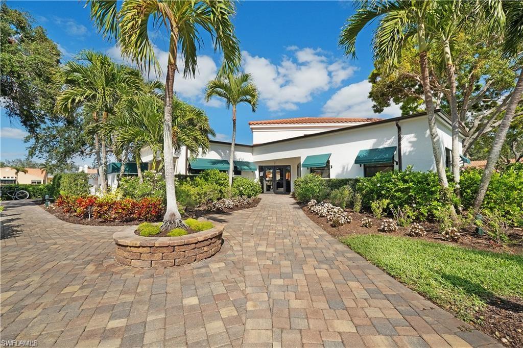 845 Reef Point Circle Naples, FL 34108 - Photo 38 of 41 a front view of a house with a yard and fountain