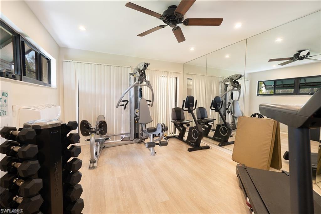 845 Reef Point Circle Naples, FL 34108 - Photo 39 of 41 a view of a room with gym equipment