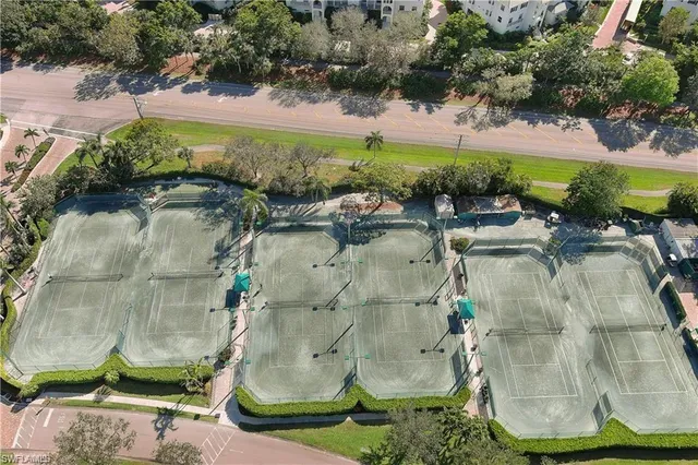 an aerial view of a residential houses with outdoor space