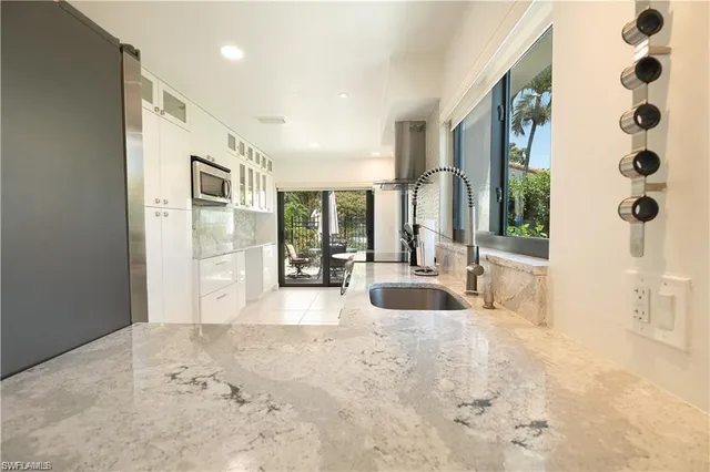 a view of livingroom with furniture and floor to ceiling window
