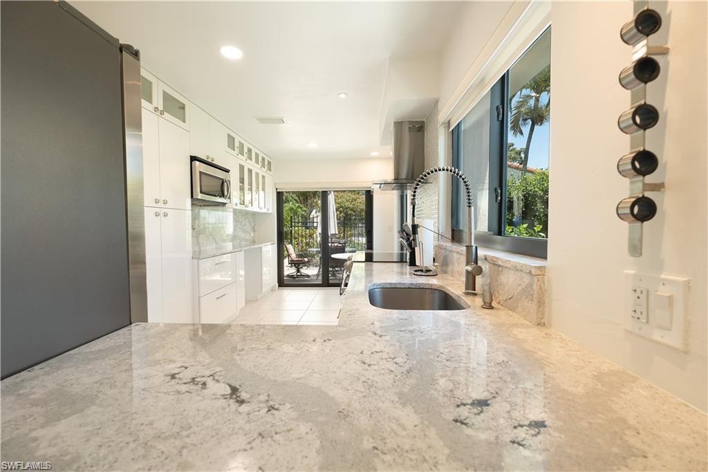 845 Reef Point Circle Naples, FL 34108 - Photo 5 of 41 a view of livingroom with furniture and floor to ceiling window
